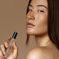 DIME Dans Les Bois travel-size spray held for easy daytime touch-ups.