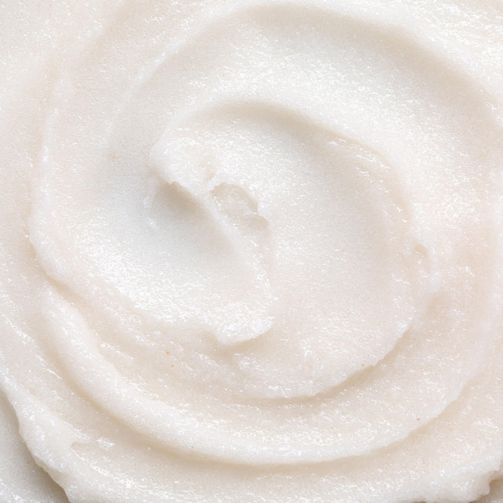 Ingredients on wooden board: goat milk, chamomile, sugar for skin care