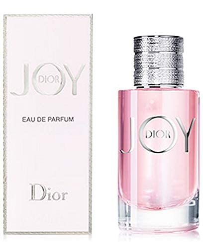 Dior Joy EDP 3 oz bottle on a vanity suggests effortless scent layering.