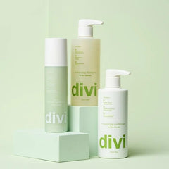 Divi Leave-In conditioner spray application showing even distribution on lengths.