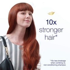 Dove Daily Moisture shampoo applied to dry hair for silky, easy-to-manage results.