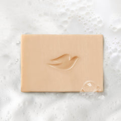 Dove Plant Milk Cleansing Bar demonstrates sulfate-free formula for sensitive skin.
