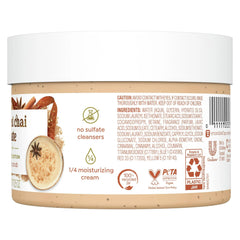 Close-up of fine exfoliating particles in Dove scrub for even texture.