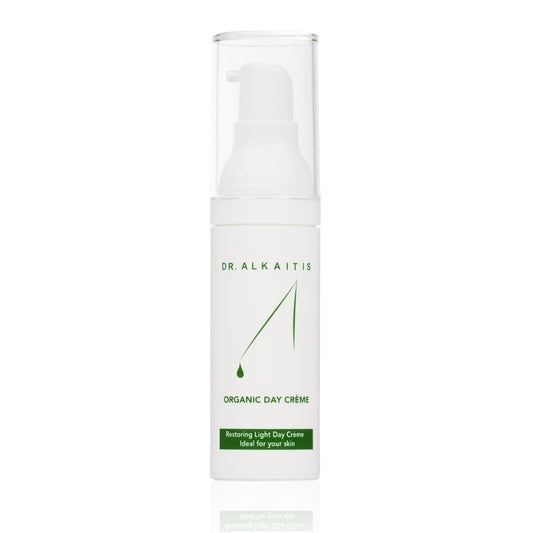 DR. ALKAITIS Organics Day Crème bottle with creamy texture and daily protection.