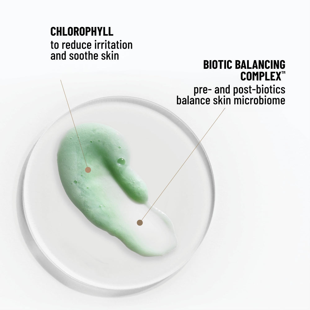 Dr. Brandt Clean Biotic bottle being squeezed to form a light lather for makeup removal