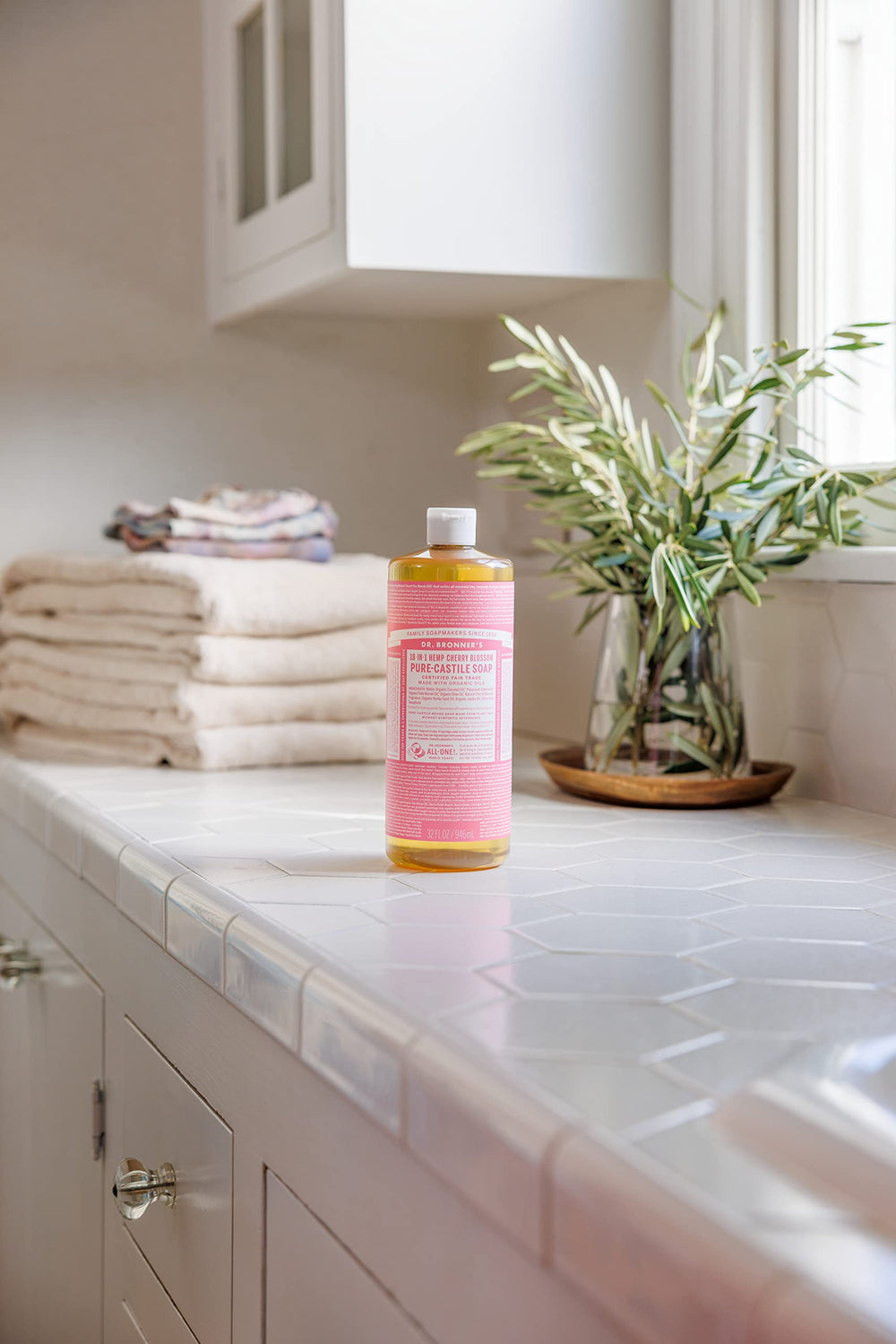 Creamy lather of Dr. Bronner's Organic Cherry Blossom liquid Castile soap.