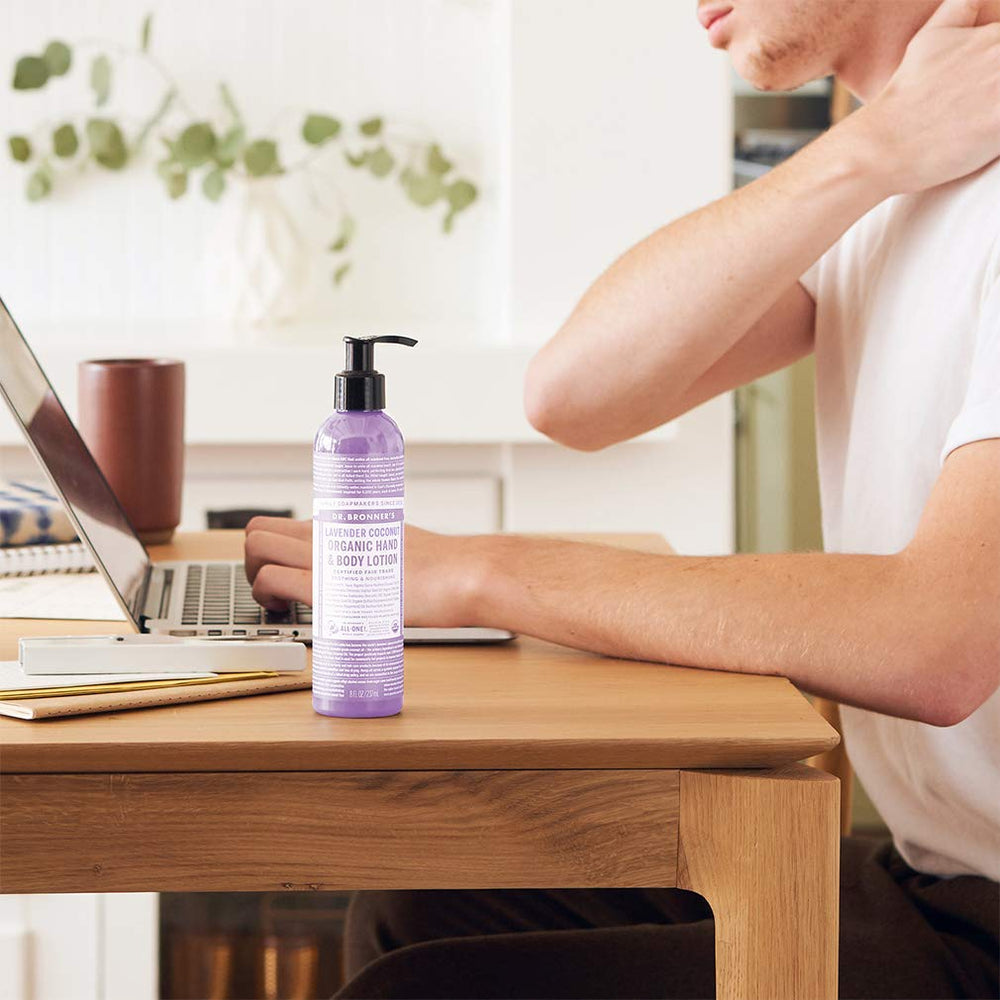 Dr. Bronner's Organic Lotion orange lavender bottle, bright, uplifting scent for daily moisture.