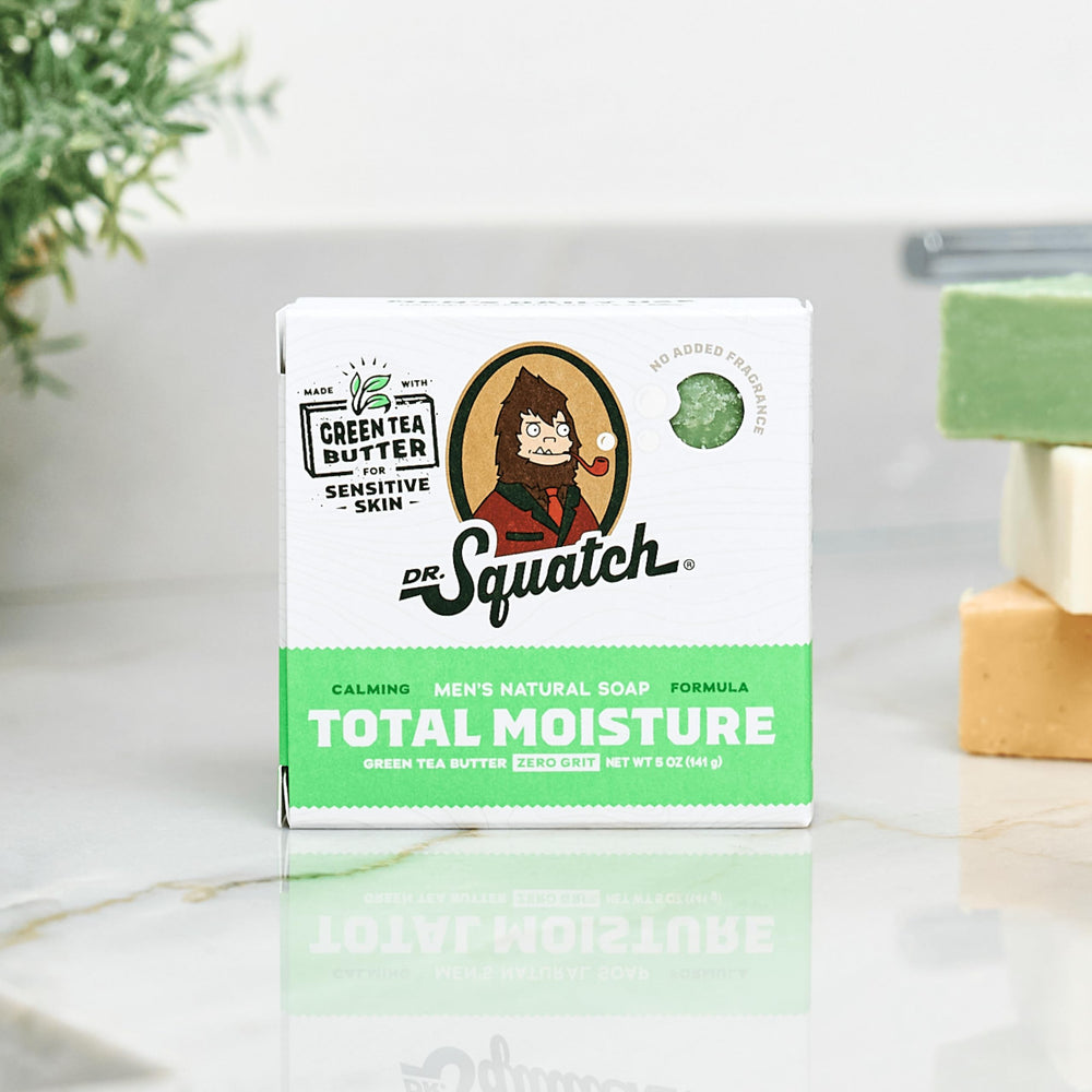 Dr. Squatch Total Moisture bar soap in hand suggests a simple, refreshing daily cleanse.