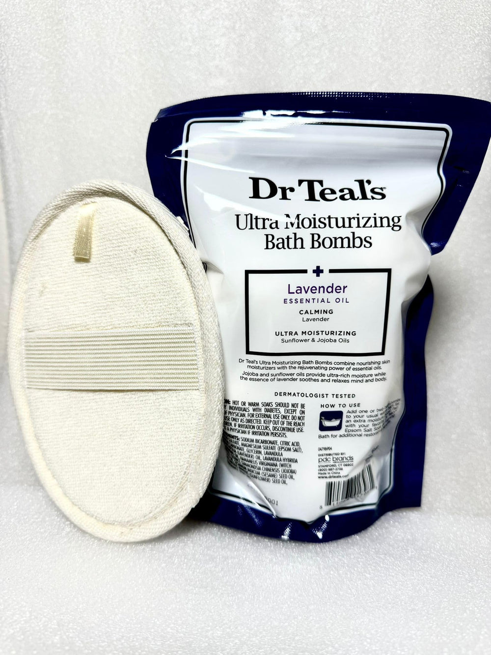 Lavender bath bombs dissolving in a tub, creating a calming spa-like soak.