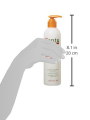 Dr Teal's Cantu smoothing leave-in packaging next to towel-dried hair close-up