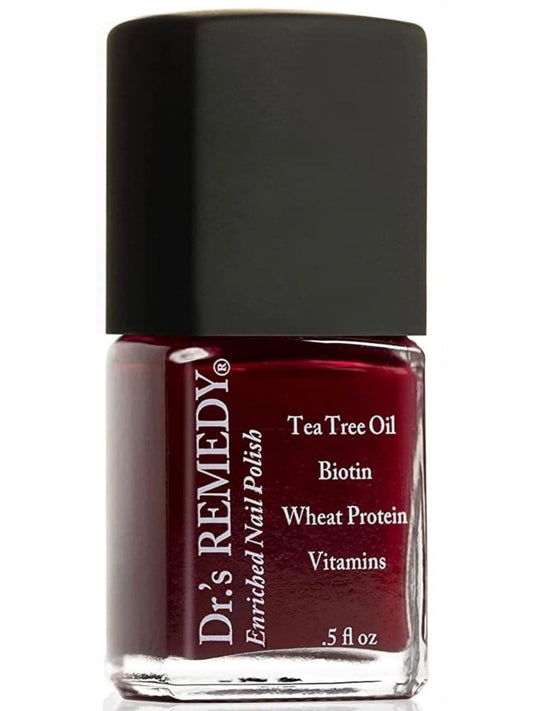 Dr. Remedy Enriched Nail Polish bottle in SASSY Scarlet with salon-style shine.