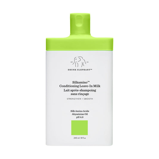 Drunk Elephant Silkamino leave-in milk bottle showing conditioning formula for hair.