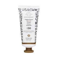 Drunk Elephant Umbra Cocoa Mineral Cream bottle close-up showing mineral SPF protection for daily use.