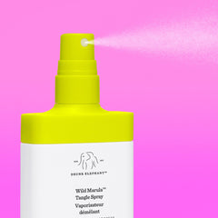 Drunk Elephant Wild Marula Tangle Spray applied to damp hair for smoother styling