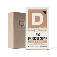 Buck Moon bar soap on a shower shelf ready for daily use.