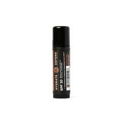 Duke Cannon Lip Balm 140deg SPF30 applying on lips outdoors