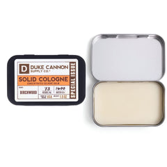 Duke Cannon Birchwood balm on fingertips enables controlled scent use.