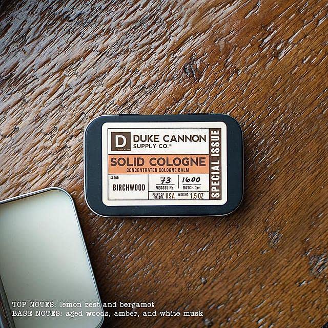 Duke Cannon Birchwood solid cologne close-up highlights natural ingredients.