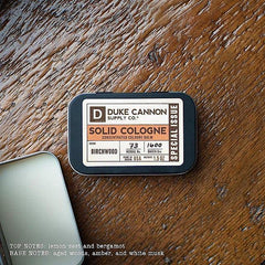 Duke Cannon Birchwood solid cologne close-up highlights natural ingredients.