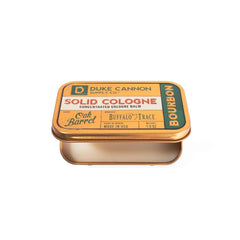 Duke Cannon solid cologne application on wrist delivers woodsy aroma.