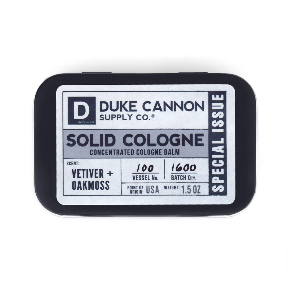 Duke Cannon solid cologne tin closeup for travel-ready freshness.
