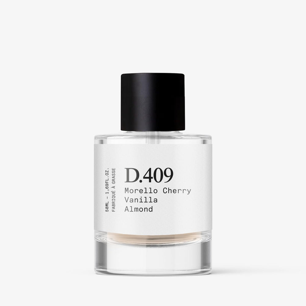 Dupe. Paris D.409 packaging emphasizes vegan, clean ingredients for responsible luxury.
