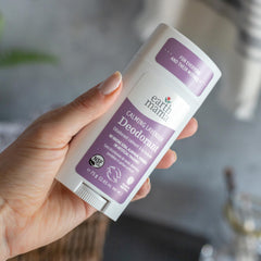 Earth Mama Calming Lavender Deodorant applying underarm in routine use before bed.