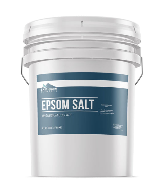 Earthborn Elements Epsom Salt bucket pour demonstrates quick dissolution for relaxing baths.