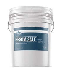 Earthborn Elements Epsom Salt bucket pour demonstrates quick dissolution for relaxing baths.