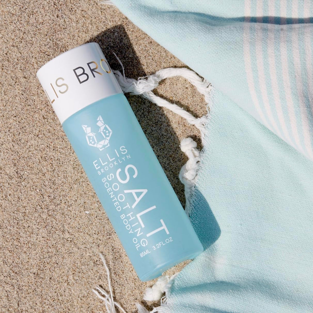 Close-up of Ellis Brooklyn SALT Body Oil highlighting ylang ylang note for mood-enhancing fragrance.
