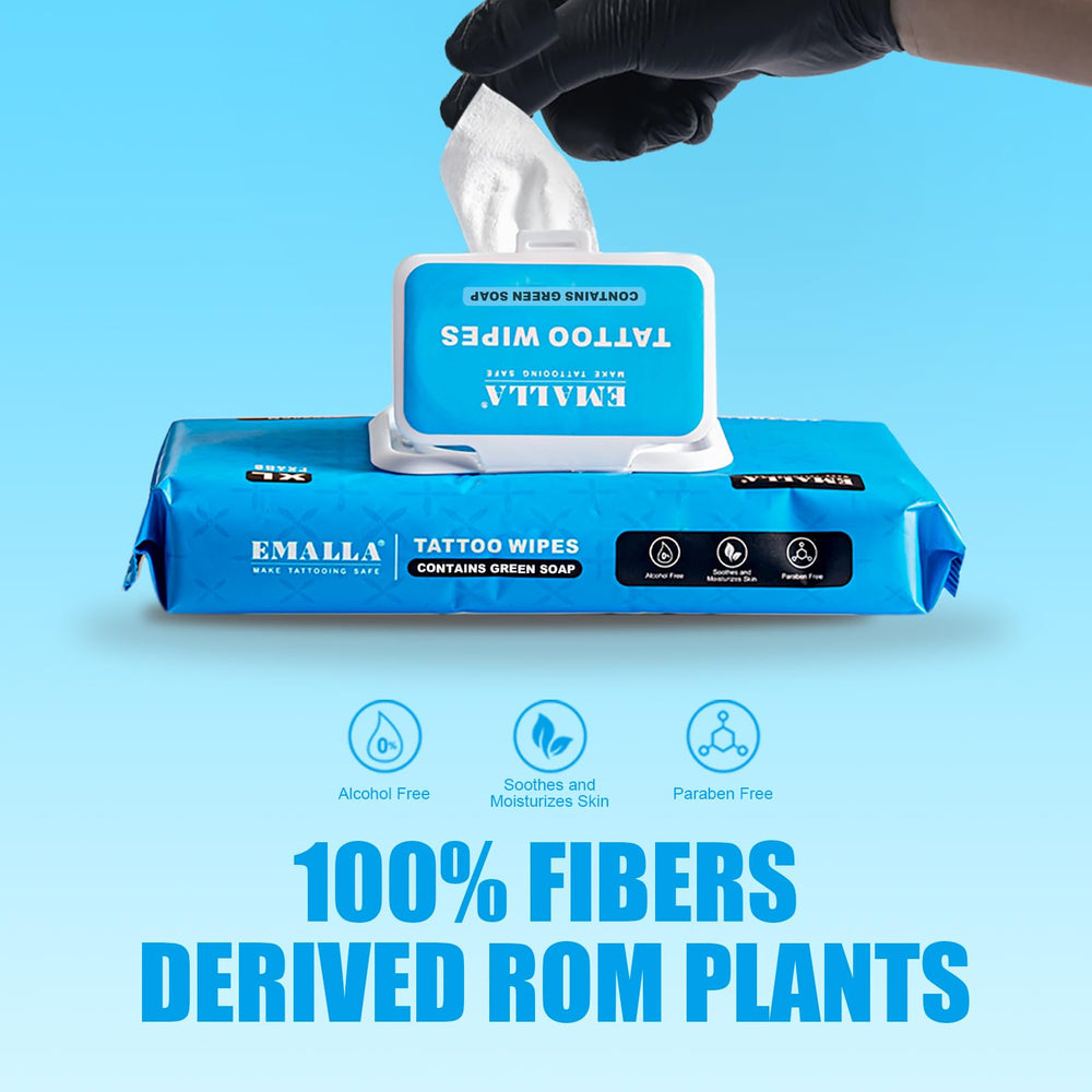 Applying Emalla wipes around a fresh tattoo to cleanse and soothe.