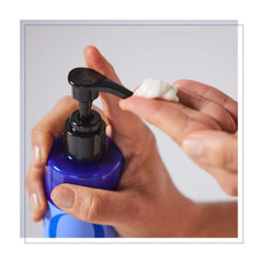 EO deodorant spray being applied for easy everyday freshness.