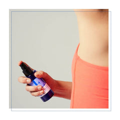 EO Orange Blossom Vanilla shower scene with water droplets for a refreshing start.