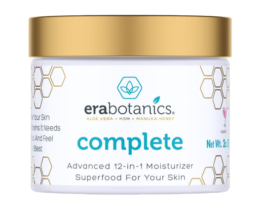 Era Organics face moisturizer jar closeup showing creamy texture for daily hydration