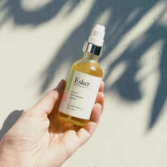 Close-up of Cypress hero oil and plant ingredients in Esker formula for balanced skin.