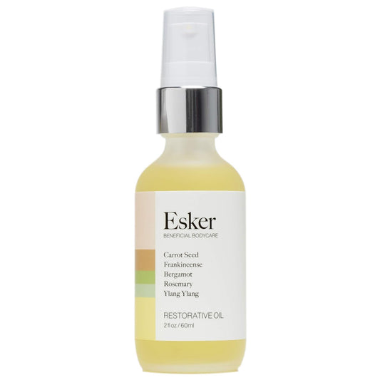 ESKER Restorative Body Oil bottle closeup shows premium hydration and antioxidant-rich formula.