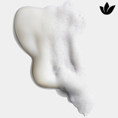 Shampoo bottle with splash suggesting refreshing, hydrating cleanse