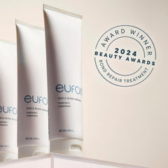 Eufora Triple Bond Repair Treatment bottle on salon display signals premium care for routine use.