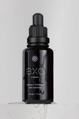 EXO C-SERUM application tapping to aid absorption and evening tone.