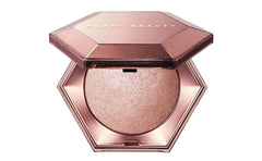 Fenty Beauty Diamond Bomb veil bottle front showing crystal sparkle for radiant finish.