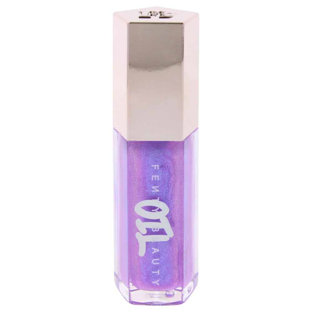 Fenty Beauty Gloss Bomb Miss Jellyfish applying gloss for smooth color.