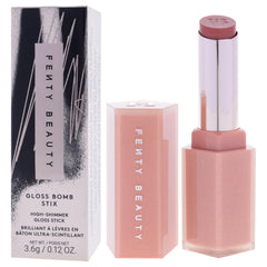 Gloss Bomb Stix Shimmer on lips highlighting a luminous, plump-looking finish