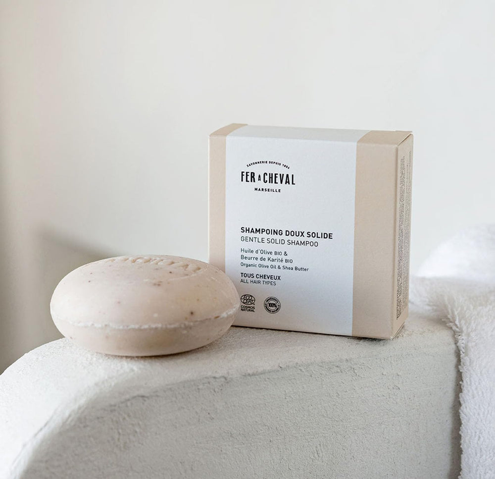 Fer à Cheval shampoo with shea butter supports smooth detangling.