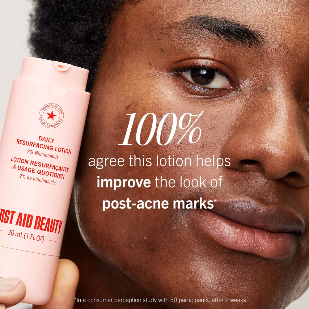 First Aid Beauty Lactic Acid Lotion surrounded by other skincare items for nightly routine.