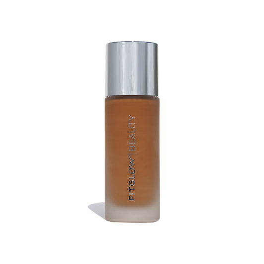 Fitglow Beauty Foundation+ bottle close-up shows vegan packaging for a natural finish