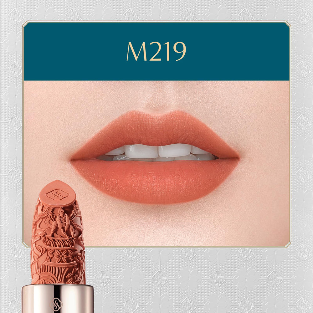 FLORASIS Blooming Rouge Lipstick in hand demonstrates feathered, misty matte finish.