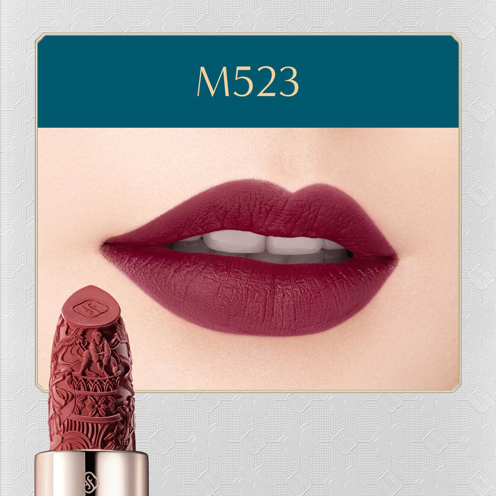 Swatch of FLORASIS Blooming Rouge Plum Royale on lips showing a misty matte finish