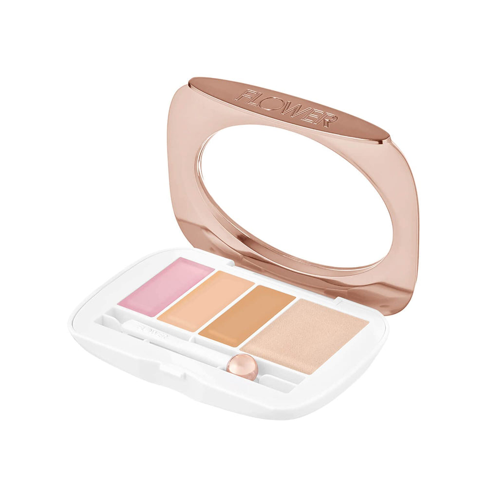 FLOWER BEAUTY cooling wand in use depuffs and preps the under-eye area.