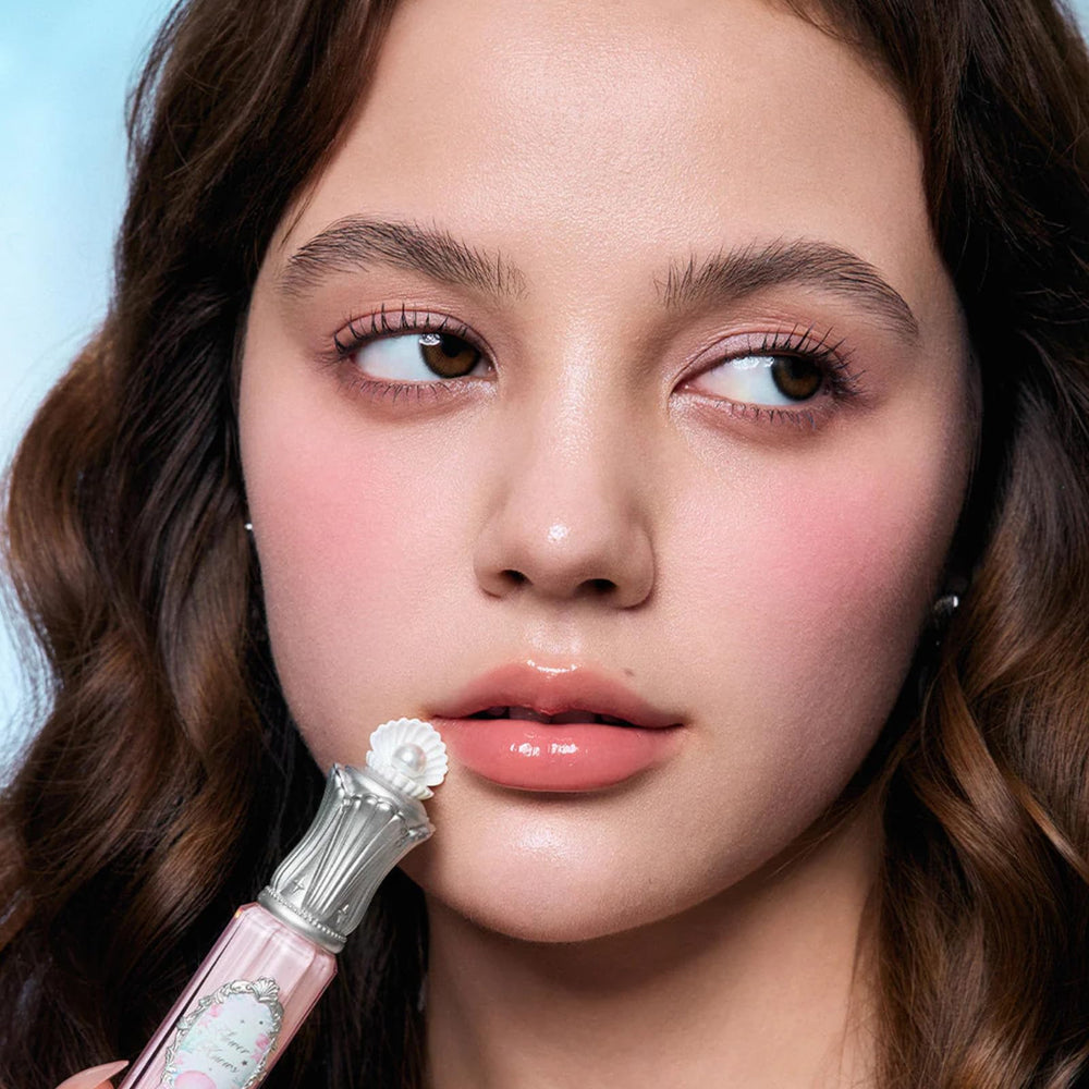 Flower Knows Shell's Jewel lip glaze in pinky apricot for daily wear.
