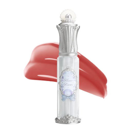 Flower Knows Shell's Jewel Nourishing Lip Glaze tube close-up highlighting a hydrating lip care